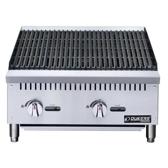 Dukers DCRB24 char-broiler side angle view showing 24-inch stainless steel body and burner controls