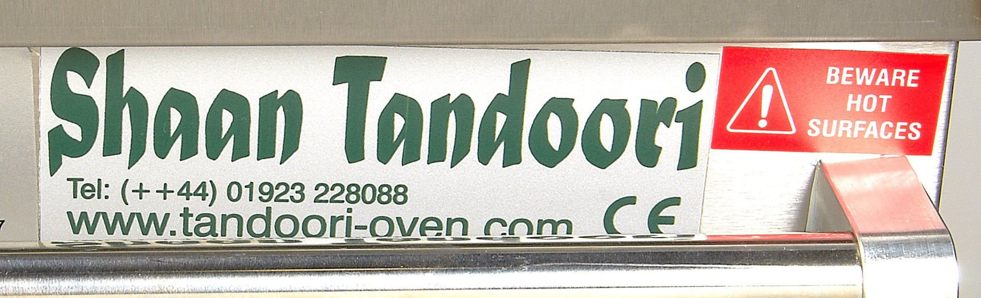Shaan Tandoori Clay Oven with logo and telephone number